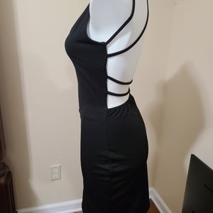 Strappy backless black dress. Fits size 4-6